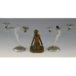 A pair of Art Deco chrome figural candlesticks, 21 cm high, and a spelter figure of a nude, 16 cm