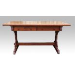 Gothic Revival oak table, the top with chip carved edge, on shaped uprights, pierced stretcher