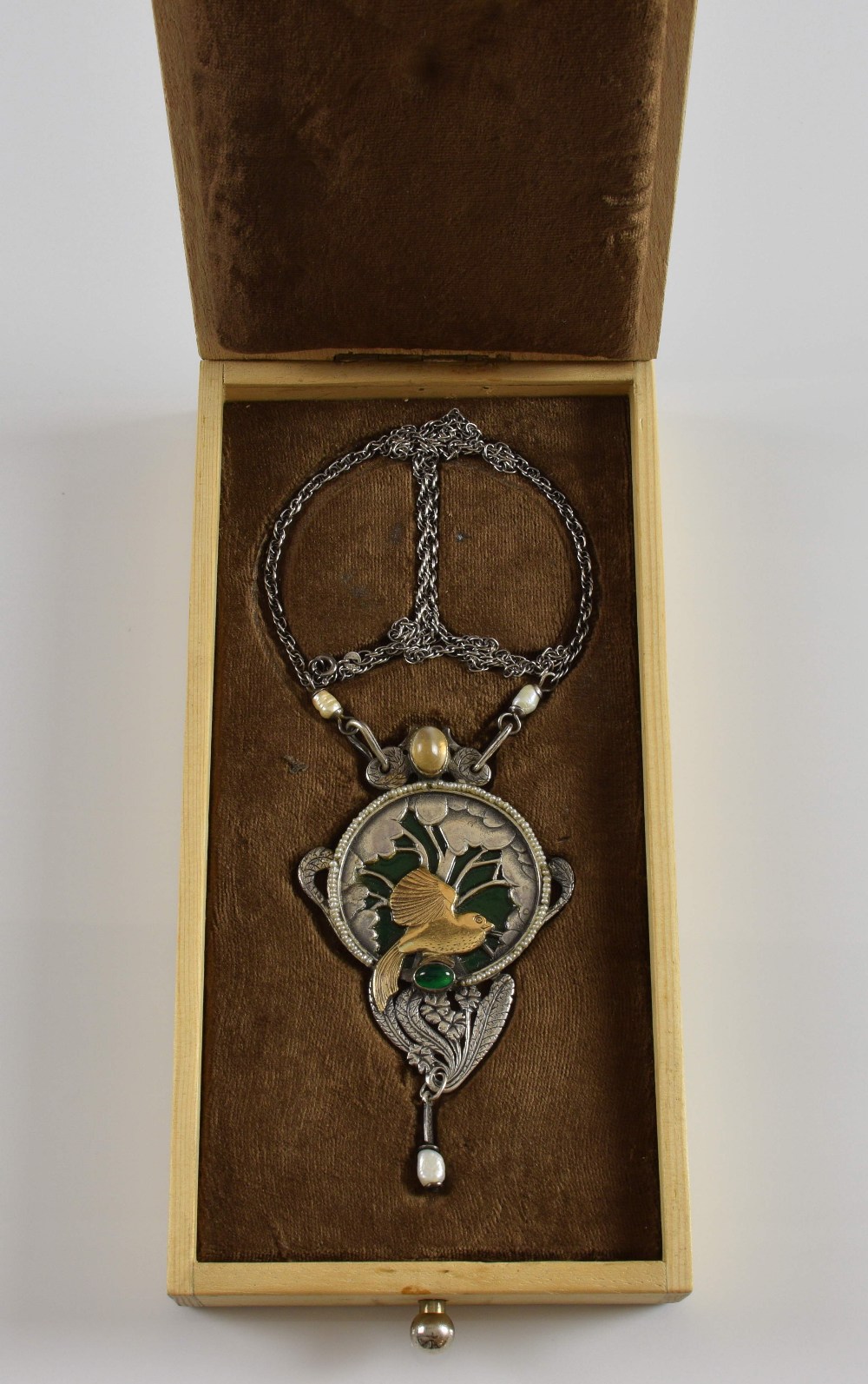 An Arts and crafts style pendant, in silver and gold with central bird and branches against a - Image 2 of 2