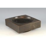 Troika dish, in a bronze glaze, on round foot, marked to base, 23.5cm square,.