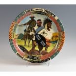 Ardmore pottery plate, Natal Native Troops Searching The Field After Ulundi, painted by Andrew, made