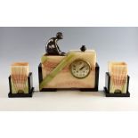 A French Art Deco onyx and marble sunburst clock & garniture, the stepped rectangular case with