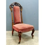 Victorian walnut and upholstered chair on cabriole legs with scroll feet, 103 cms.