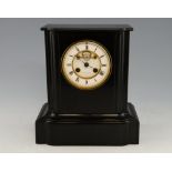 French black marble mantel clock, with twin train movement, visible escapement, white enamelled