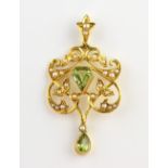 Edwardian gold peridot and pearl openwork pendant, stamped 15 ct, 4 cm . Good condition, 3.7 grams