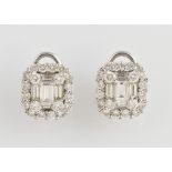 A pair of diamond cluster earrings, with central baguette cut stones with brilliant cut stone