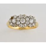 1930's diamond triple cluster ring, old cut diamonds, mounted in yellow metal stamped 18 ct, ring