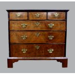 18th century walnut three chest of three short and three long drawers with inlaid banding, centre