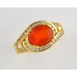 Fire opal dress ring, oval cut fire opal, estimated weight 1.95 carats, set with round brilliant and