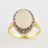 Vintage opal and diamond ring, central oval cabochon cut opal, estimated weight 1.93 carats,