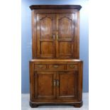 19th century oak standing corner cupboard, the top with two cupboard doors the base with three