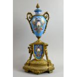 19th century single gilt metal and porcelain clock garniture 40cm high PROVENANCE: Sold on behalf of