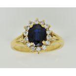 Sapphire and diamond cluster ring, oval cut sapphire, estimated weight 1.54 carats, set within a