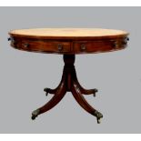 19th century mahogany drum table with yellow leather tooled and gilt top above four drawers one