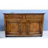 Mid 18th century oak dresser base, peg construction with later inlay, two drawers over two