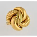 Vintage 1940's gold dress ring, central leaf design set above four curved sections, with white metal