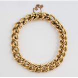 Victorian fancy link bracelet, with hidden clasp and safety chain, in 15 ct yellow gold, measuring