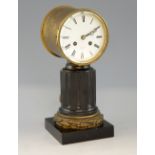 19th century French drum clock on a black marble column and ormolu base, the white enamel face