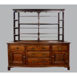 18th century oak dresser with associated three tier plate rack above base with three drawers flanked