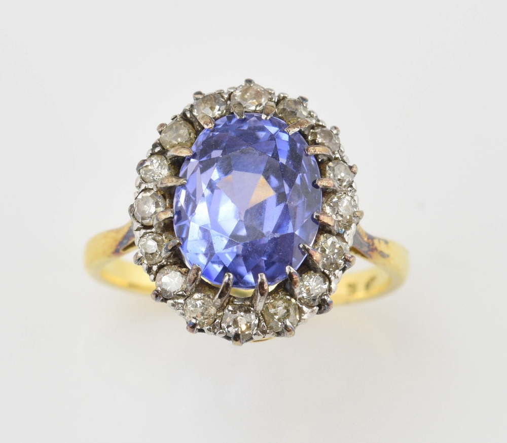 1920's sapphire and diamond cluster ring, oval sapphire estimated weight 6.25 carats, round old