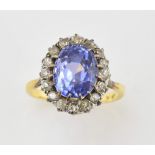 1920's sapphire and diamond cluster ring, oval sapphire estimated weight 6.25 carats, round old