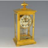 Ansonia Clock Company brass and glass mantel clock with twin train movement, open escapement,