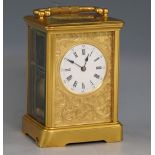 French brass and four glass carriage clock with lever movement, gilt engraved face plate with with