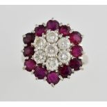 Vintage ruby and diamond cluster ring, set with seven round brilliant cut diamonds, estimated