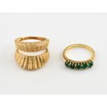 Vintage 1970's, two rings, designed to be worn as one, central five green paste stones claw set in