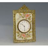 Porcelain and gilt metal strut clock, decorated with pink flowers, 28cm x 16.5cm. Provenance: part