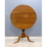 19th century oak tilt top tripod table. on column support to tripod base, diameter 77cm .