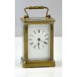 Early 20th century brass and glass carriage clock , 15cm .