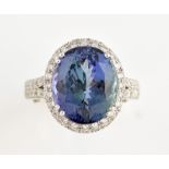 Tanzanite and diamond set ring, the large central stone estimated at 8.60 carat, predominately blue,