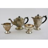 George V silver four piece tea service, comprising teapot, hot water jug, two handled sugar bowl,