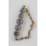 Mid 20th C sapphire bracelet, five graduated cushion cut blue sapphires, estimated total weight 8.97