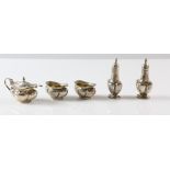 George V silver Art Nouveau five piece cruet set, comprising pair of salts, pair of pepperettes