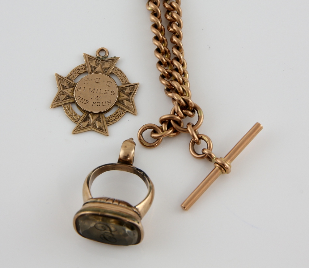 Victorian albert chain, medal, all mounted in 9 ct gold a stone set seal in yellow metal testing