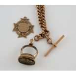 Victorian albert chain, medal, all mounted in 9 ct gold a stone set seal in yellow metal testing
