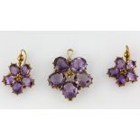 Victorian amethyst pansy pendant, five oval cut amethyst, mounted in yellow metal testing as 15