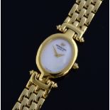 A Lady's Raymond Weil gold plated dress watch, with signed mother of pearl oval dial, a gold