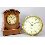 Brass bulkhead clock 23cm dia, and a late 19th century walnut mantle clock with German movement.