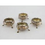 Set of four Victorian silver salts with gadrooned rims, each on three shell and hoof feet, by