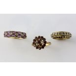 Three gem set rings, amethyst and diamond ring, size N, with a garnet cluster ring, size M, and