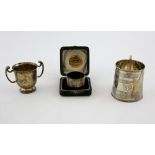 Silver mug with banded decoration London 1900, a small silver two handled challenge cup and a