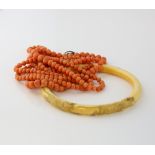 Graduated coral bead necklace, round beads measuring 4 to 6mm in diameter, strung on cord, measuring