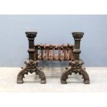 Pair of 19th century cast metal fire dogs and basket 42 cm