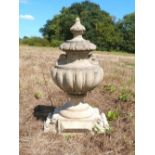 Composite stone finial in the from of an urn 54cm