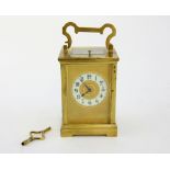 French brass carriage clock, the repeating movement striking on a gong, 18cm high