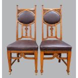 Set of six Art Nouveau oak dining chairs with carved decoration,