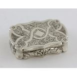 Victorian silver vinaigrette of serpentine form with bright cut foliate decoration, maker's mark '